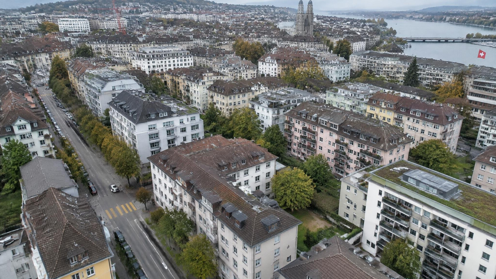 Aerial view of a Swiss city with dense housing blocks